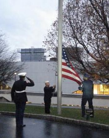 Army Navy and Marine raise US flag